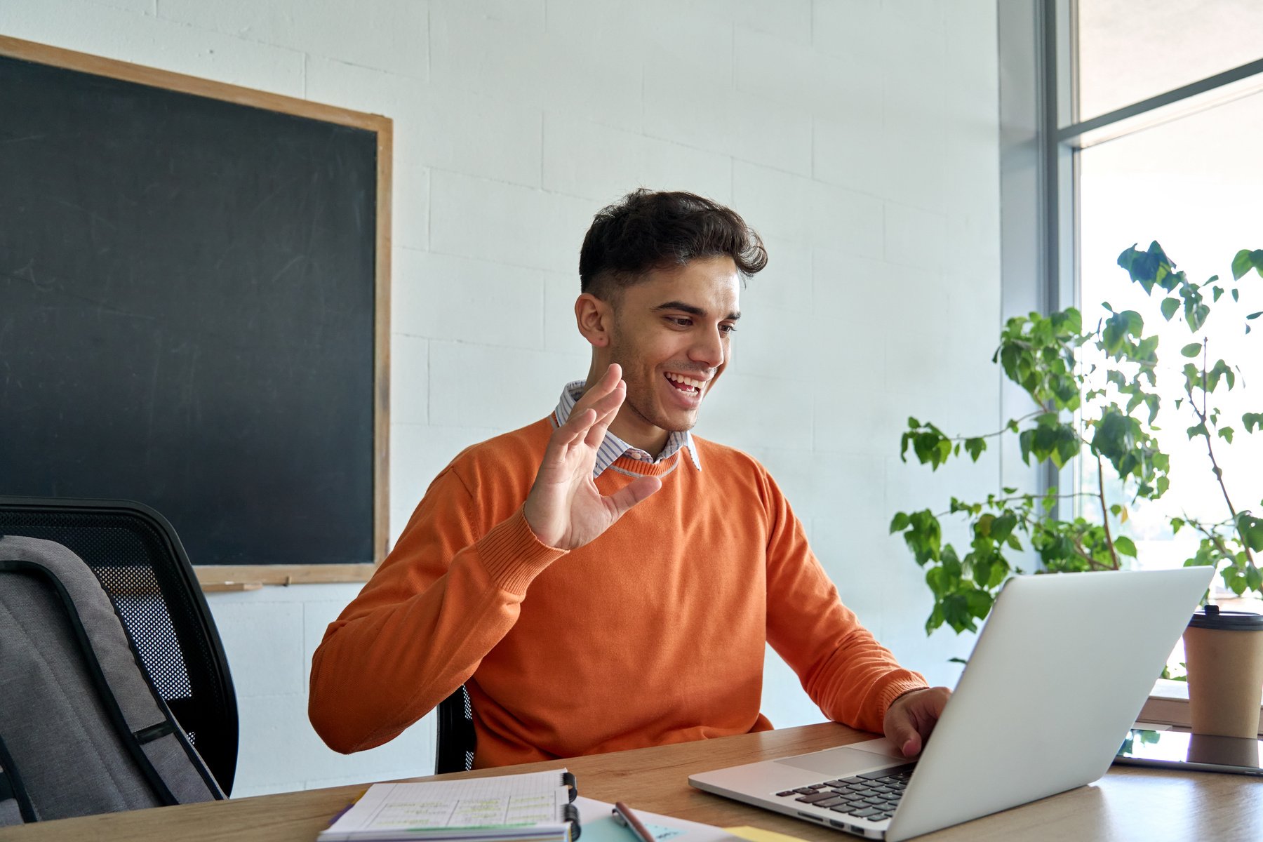 Male Student Studying Online Through a Video Call